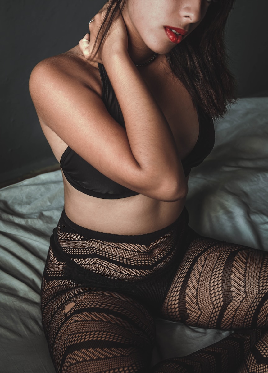 woman in black brassiere and black and brown pants